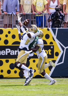 Jackets DB Jamal Golden knocks a pass away from Green Wave WR Teddy Veal