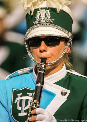 Green Wave Band member marches at halftime