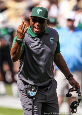 Tulane Green Wave Head Coach Curtis CJ Johnson questions the referees about the indicated down