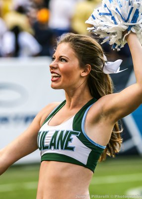 Tulane Green Wave Dance Team member on the sidelines