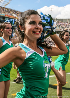 Tulane Green Wave Cheerleader on the sidelines 