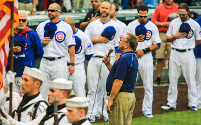 Wayne Messmer sings the National Anthem prior to the start of the game