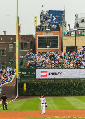 Chicago 3B Kris Bryant stands in front of the Wrigley Ivy, Bleachers and Rooftops