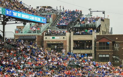 The left field stands at Wrigley Field are framed by the Rooftop establishments