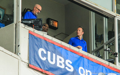 Cubs broadcasters call the game from above Wrigley Field