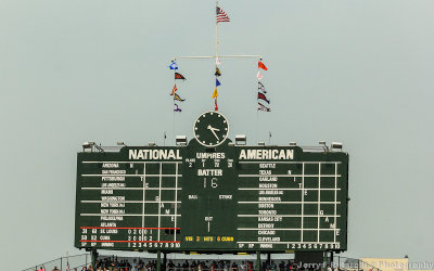 The manual scoreboard, with pennants flying, at Wrigley Field