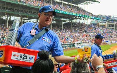 A Wrigley Field beer vendor works the crowd during the game