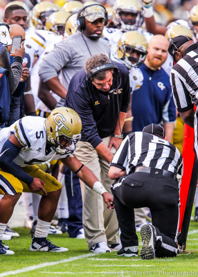 Jackets QB Justin Thomas and Head Coach Paul Johnson assist the referee with the first down measurement