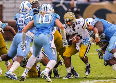 Georgia Tech QB Justin Thomas runs into the middle of the NC Defense