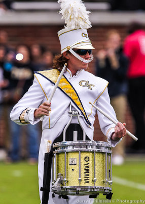 Yellow Jackets drummer plays during halftime