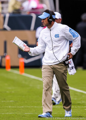 North Carolina Head Coach Larry Fedora on the field during a timeout
