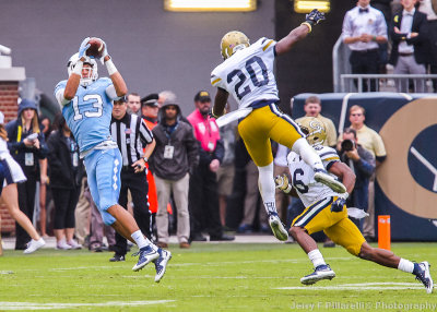 Tar Heels WR Mack Hollins makes a leaping catch over Jackets DB Austin