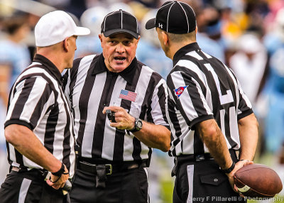 Game officials confer after a penalty flag was thrown