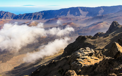 Clouds creep into the Haleakala Crater as seen from the Leleiwi Overlook in Haleakala National Park