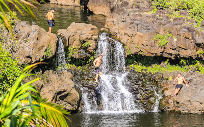 Visitor jumps off a waterfall into one of the many pools near Kuloa Point in Haleakala National Park