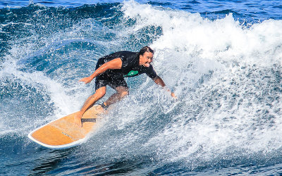 Surfer on a roll at Hookipa Beach along the Road to Hana 