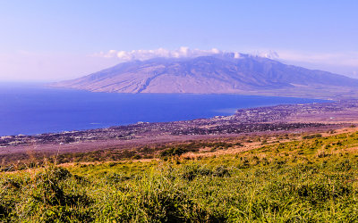 Puu Kukui in the clouds with the city of Kihei from inland along the Kula Highway