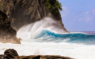 The surf breaks against Pola Island in the National Park of American Samoa 