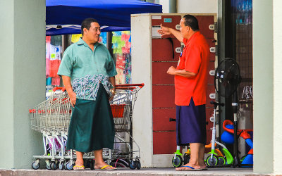 Two Islanders wearing the traditional Lava-Lava sarong in American Samoa