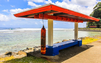 Bus stop with a Sa bell on Highway 001 in American Samoa