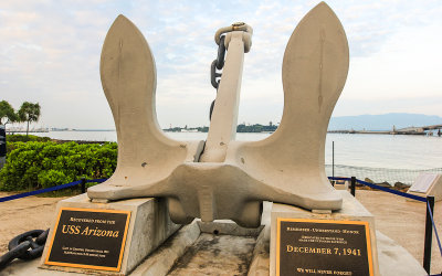 Anchor, with the memorial in the background, recovered from the USS Arizona, on shore in Pearl Harbor