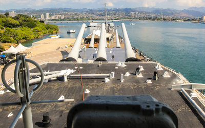 16 inch/50 caliber gun battery on the Battleship Missouri overlooking the USS Arizona Memorial in Pearl Harbor