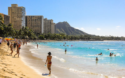 Sun worshipers in the middle of the day on Waikiki Beach
