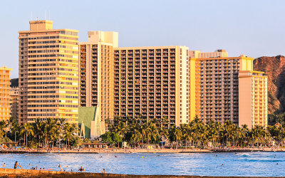 Hotels glow from the sunset on Waikiki Beach
