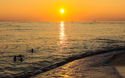 Sun setting over the water from Waikiki Beach