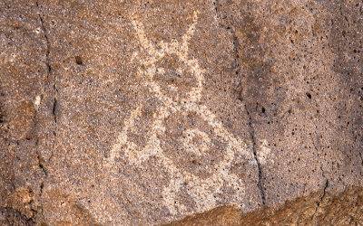 Interesting figure carved in basalt in Piedras Marcadas Canyon in Petroglyph National Monument