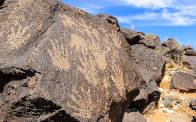 Hand prints carved in the rock in Piedras Marcadas Canyon in Petroglyph National Monument