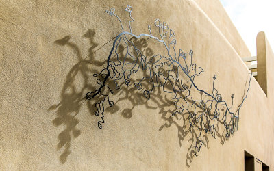 Iron work and shadows on a wall near Santa Fe Plaza