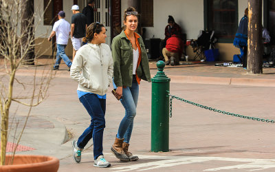 Women strolling through Santa Fe Plaza