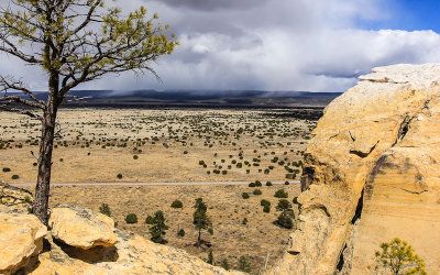 Snow falls in the distance in El Morro National Monument