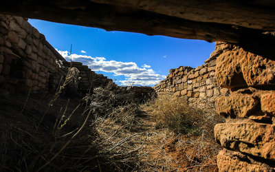 Looking through a doorway at Lowry Pueblo in Canyon of the Ancients National Monument