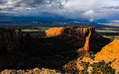 Cloud cover highlights Independence Monument at sunset in Colorado National Monument