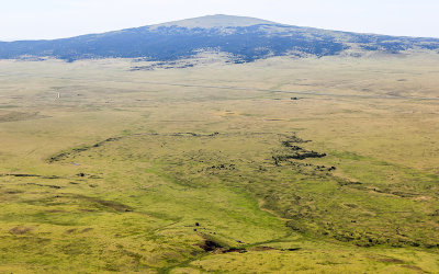 Pressure ridges lava flow with Sierra Grande shield volcano in the distance in Capulin Volcano National Monument