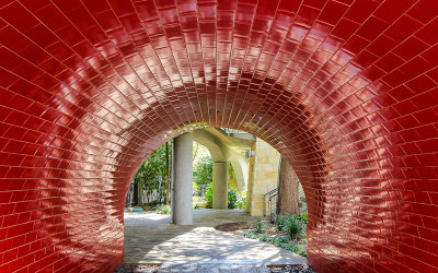 A tile walkway along the San Antonio River Walk