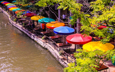 Colorful restaurant umbrellas along the San Antonio River Walk