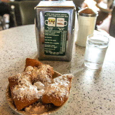 Beignets dowsed with powdered sugar at The Caf Du Monde in the French Quarter