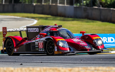 A Mazda Prototype exits the esses at the Petit Le Mans