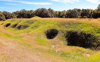 The Cornfield Mound with the Earthlodge in the background in Ocmulgee National Monument