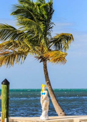 Statue and palm tree on Grassy Key in the Florida Keys
