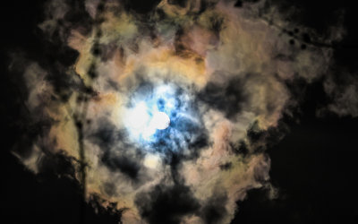 The sun and clouds reflected in the Blue Elbow Swamp