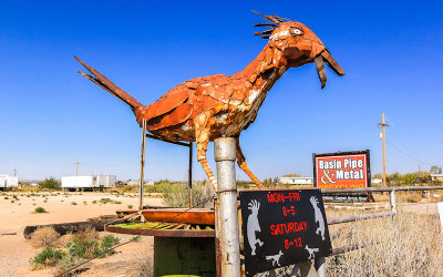 Iron roadrunner statue at Basin Pipe and Metal business near Alamogordo New Mexico