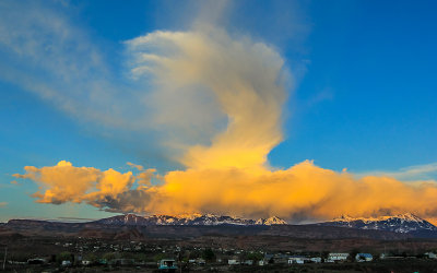 Dramatic storm clouds at sunset over the La Sal Mountains east of Moab Utah