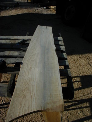 I started with the off-cut from the kitchen counter. Sanded it smooth, and cut a straight edge for the back side.