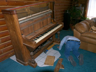 Getting the piano off the 2 dollies it has been on for the last dozen years