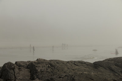 Surfers in the fog at Chesterman Beach