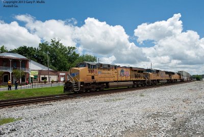 A trio of UP units leads a train westbound at Austell.jpg